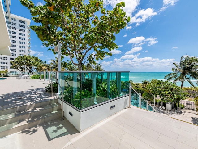 exterior space featuring a water view and a balcony