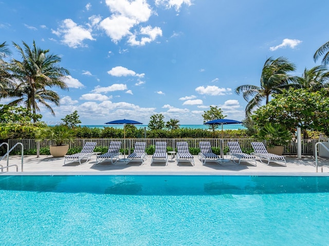 view of swimming pool featuring a patio area