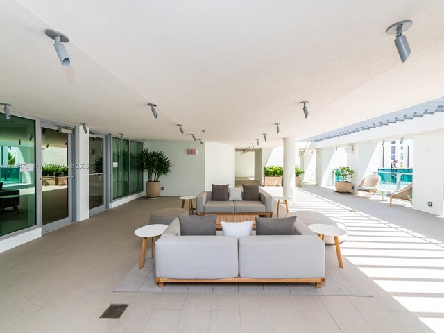 living room with a wall of windows