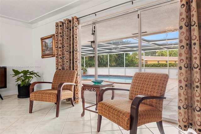 interior space with light tile patterned flooring and a textured ceiling