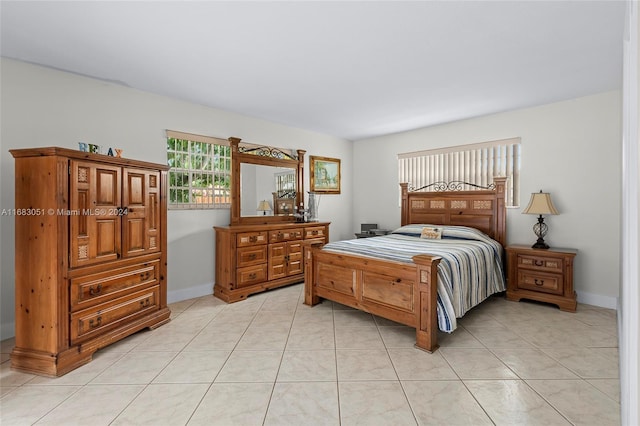 bedroom featuring light tile patterned flooring