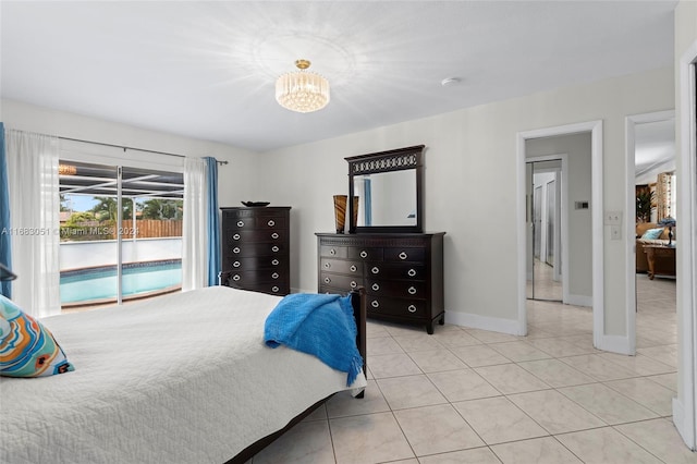 bedroom featuring a chandelier, access to outside, and light tile patterned floors