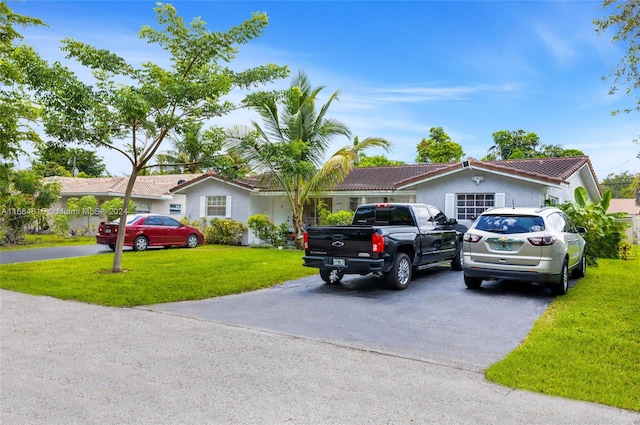 single story home with a front lawn