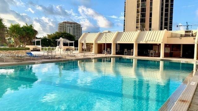 view of swimming pool featuring a patio area