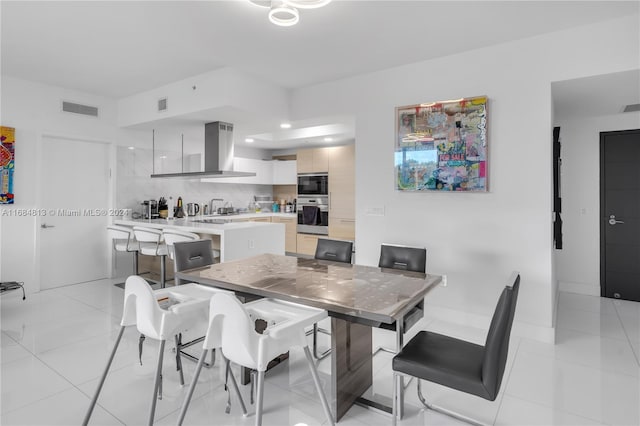 dining room featuring light tile patterned flooring