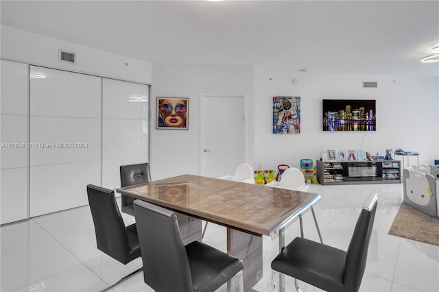 dining room with light tile patterned flooring