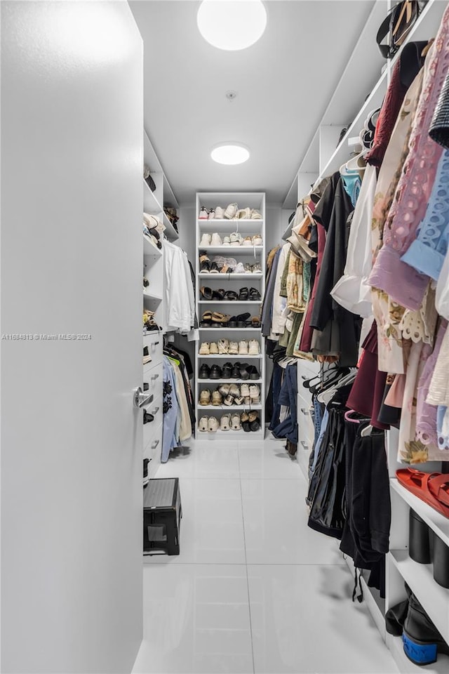 walk in closet featuring light tile patterned floors