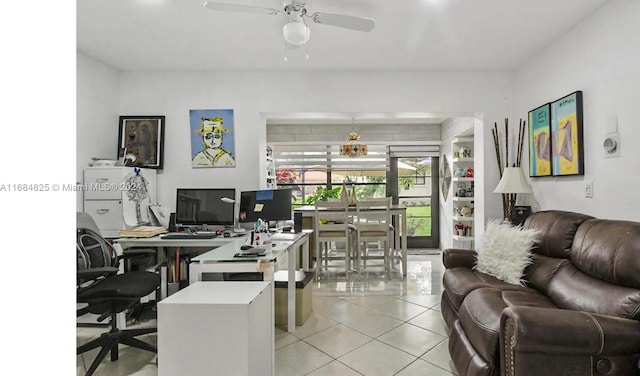 office area featuring light tile patterned flooring and ceiling fan