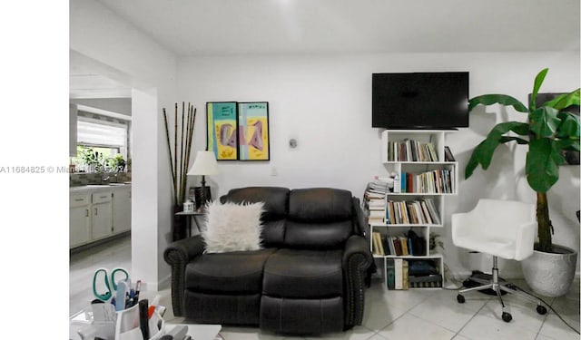 sitting room with light tile patterned flooring