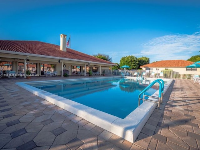 view of swimming pool with a patio