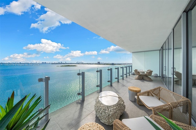 balcony featuring a water view