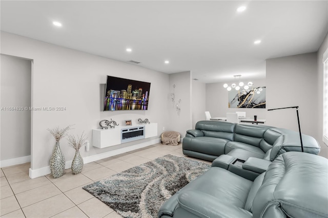 living room with light tile patterned flooring and a chandelier