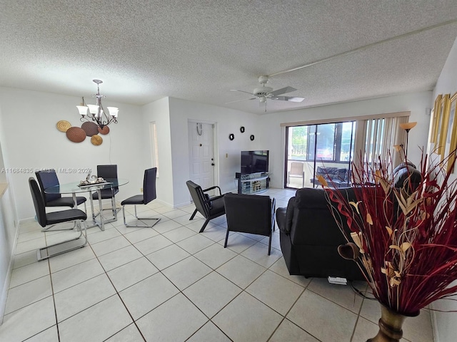 814 Sky Pine Way Unit C1, Green Acres, FL 33415 - living area with a chandelier, a ceiling fan, light tile patterned flooring, a textured ceiling, and baseboards