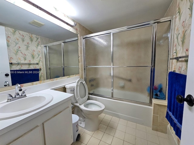 814 Sky Pine Way Unit C1, Green Acres, FL 33415 - full bath with tile patterned flooring, vanity, enclosed tub / shower combo, toilet, and wallpapered walls