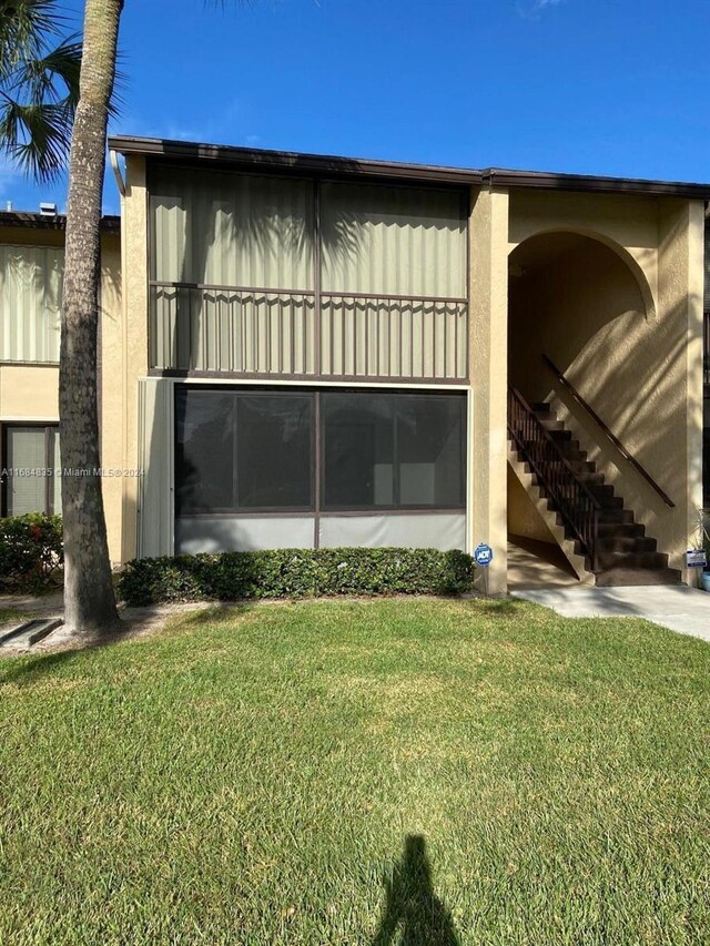 814 Sky Pine Way Unit C1, Green Acres, FL 33415 - view of property featuring stairway