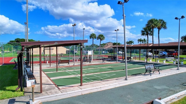 814 Sky Pine Way Unit C1, Green Acres, FL 33415 - view of community with shuffleboard and fence