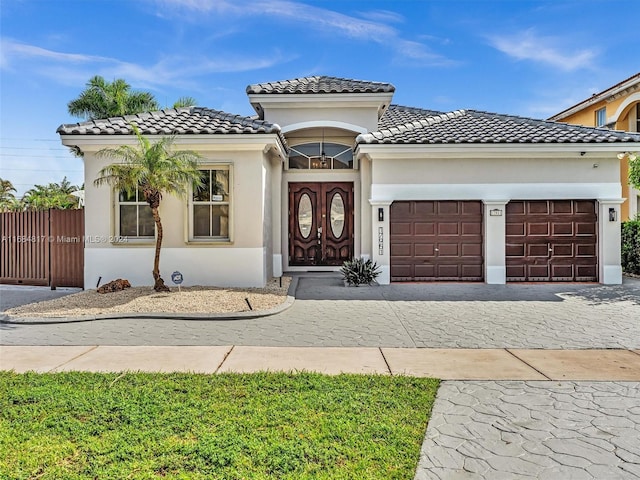 mediterranean / spanish-style house featuring a garage