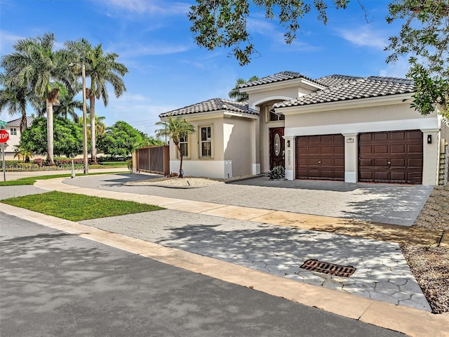 mediterranean / spanish house with a garage