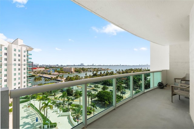 balcony featuring a water view