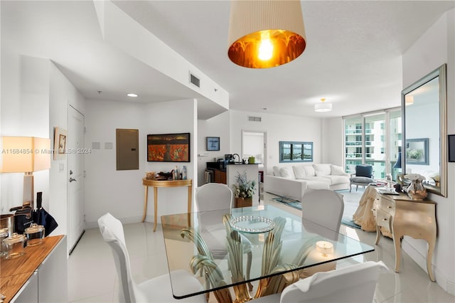 7900 Harbor Island Dr Unit 1223, North Bay Village, FL 33141 - dining space featuring electric panel, light tile patterned floors, and baseboards