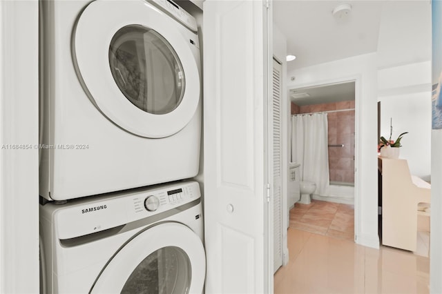7900 Harbor Island Dr Unit 1223, North Bay Village, FL 33141 - washroom featuring stacked washer / dryer and light tile patterned floors