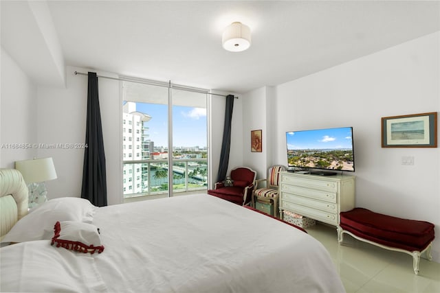 bedroom with a wall of windows