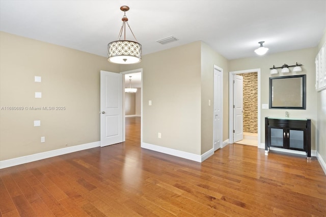 spare room featuring hardwood / wood-style floors