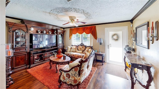 living room featuring a textured ceiling, ceiling fan, dark hardwood / wood-style flooring, and crown molding