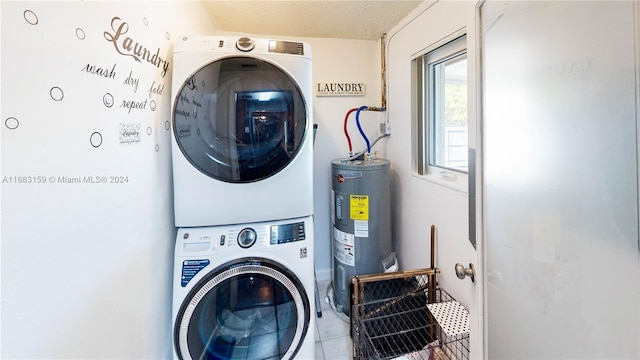 washroom featuring light tile patterned floors, water heater, stacked washer and clothes dryer, and a textured ceiling