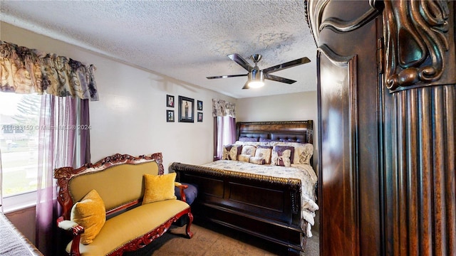 bedroom with a textured ceiling and ceiling fan