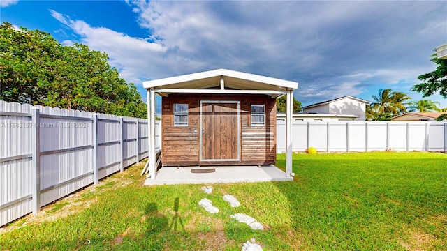 view of outbuilding featuring a yard