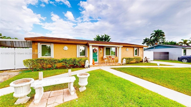 single story home featuring a front yard