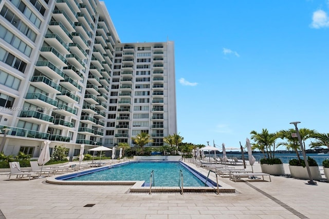 view of swimming pool featuring a patio area