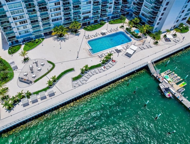 birds eye view of property with a water view