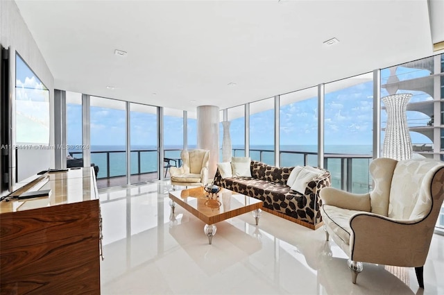 sunroom with a healthy amount of sunlight and a water view