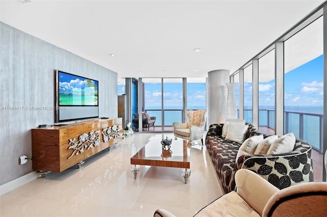 living room featuring a wall of windows and light tile patterned flooring