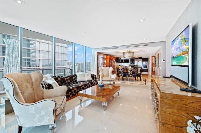 living room featuring a wall of windows, a healthy amount of sunlight, and light tile patterned flooring