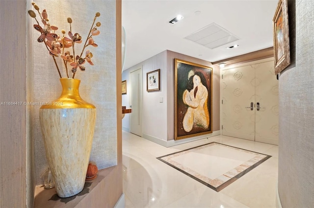 corridor with light tile patterned floors