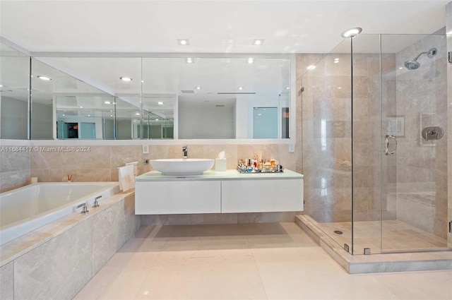 bathroom with vanity, tile patterned floors, and separate shower and tub