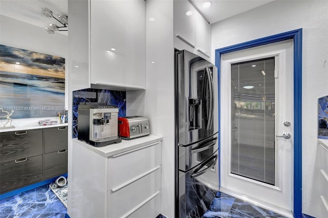 laundry room featuring a textured ceiling