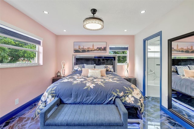 bedroom with a tile fireplace