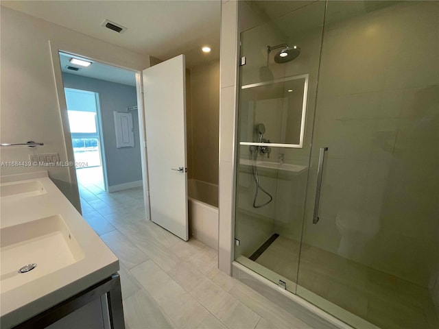 bathroom featuring vanity and an enclosed shower