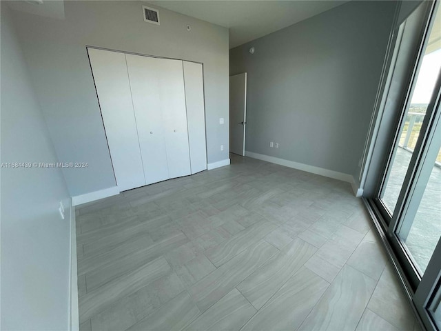 unfurnished bedroom with a closet