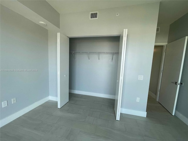 unfurnished bedroom with a closet