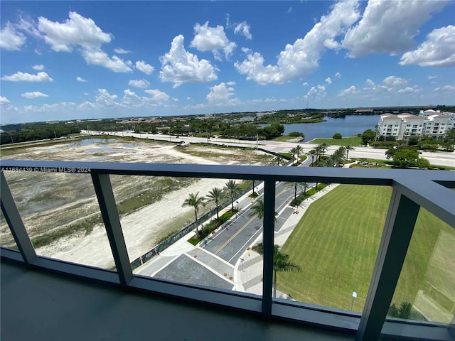 balcony featuring a water view