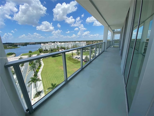 balcony featuring a water view