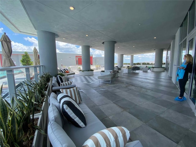 view of patio featuring an outdoor hangout area and a balcony