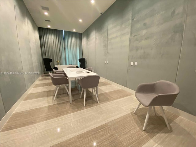 dining space featuring light tile patterned floors