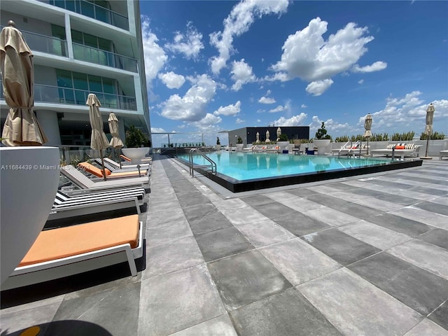 view of swimming pool featuring a patio