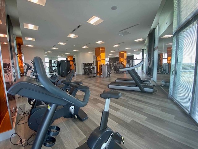 gym with light hardwood / wood-style flooring